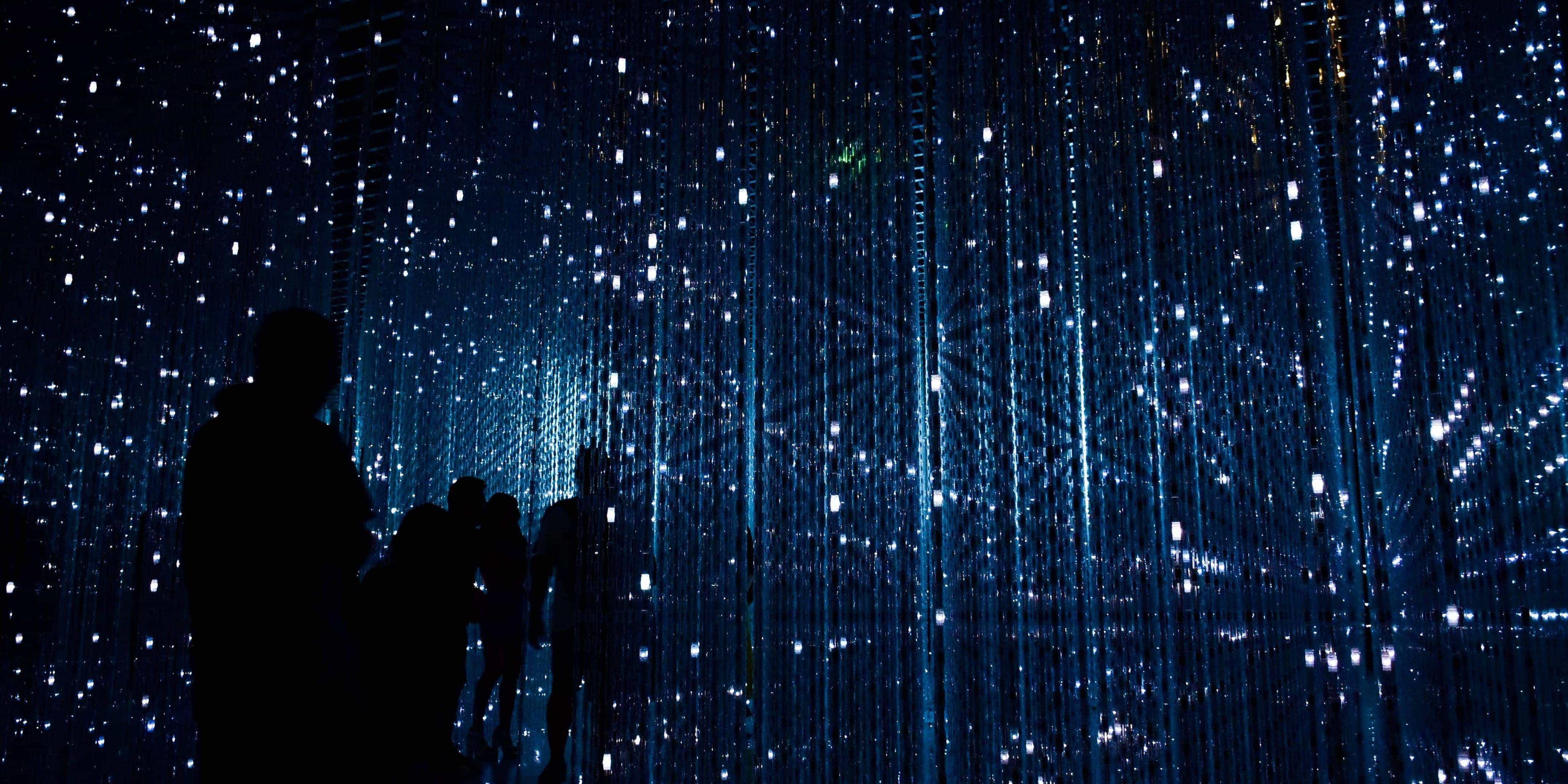 Photo of a group of people in a pitch black room